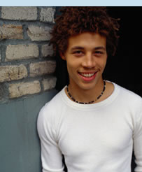 Lad leaning on wall